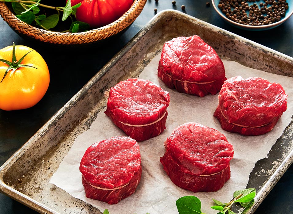 Cuts of beef medallions laid on butcher paper