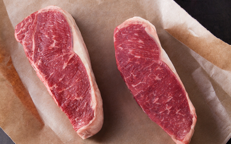 Sliced beef on butcher paper